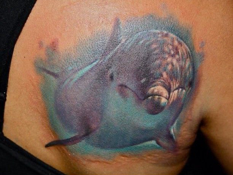 Дельфин-тату как символ стремления к свободе