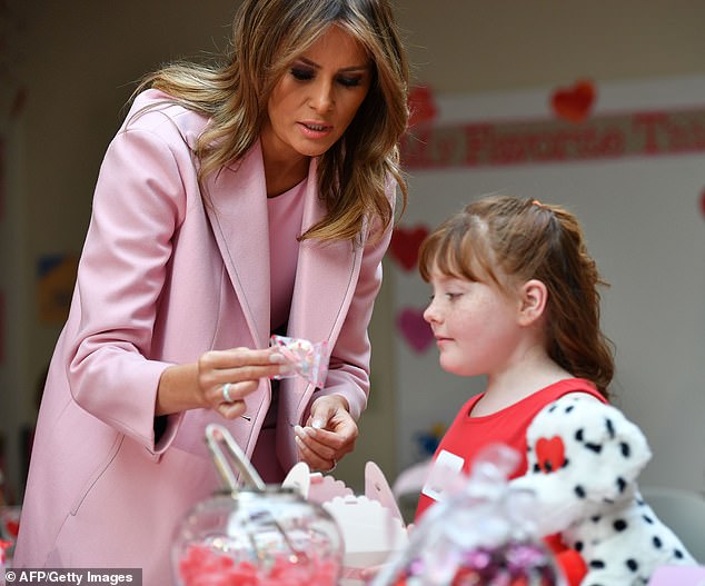 Sweet treats: The first lady helped Avery, a 10-year-old girl from Festus, Missouri, fill her box with candy. Avery received a bone marrow transplant for a rare, genetic immune deficiency