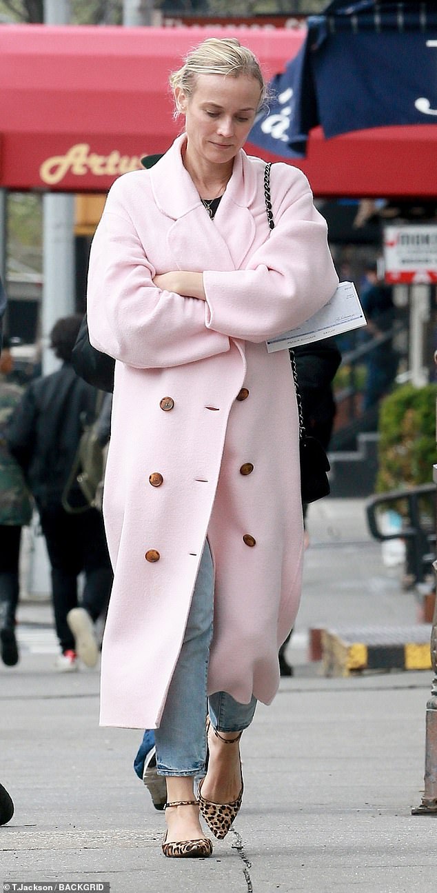 Stayed warm: The actress was as stylish as ever in a long pink coat with brown buttons that kept out the chilly Big Apple air