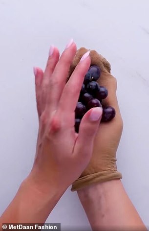 Place a bunch of grapes inside a pair of tights