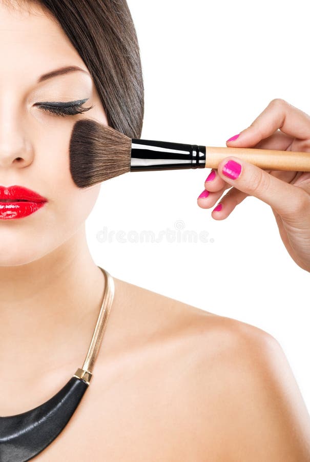 Beautiful attractive woman with half face, luxury makeup brush of his face.  stock image