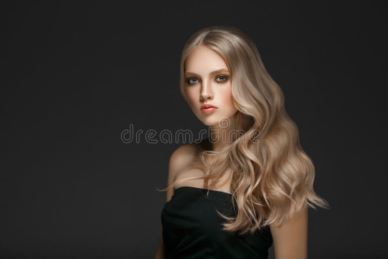 Beautiful Blonde Woman Beauty Model Girl with perfect makeup over black background. Beautiful Blonde Woman Beauty Model Girl with perfect makeup and hairstyle royalty free stock image