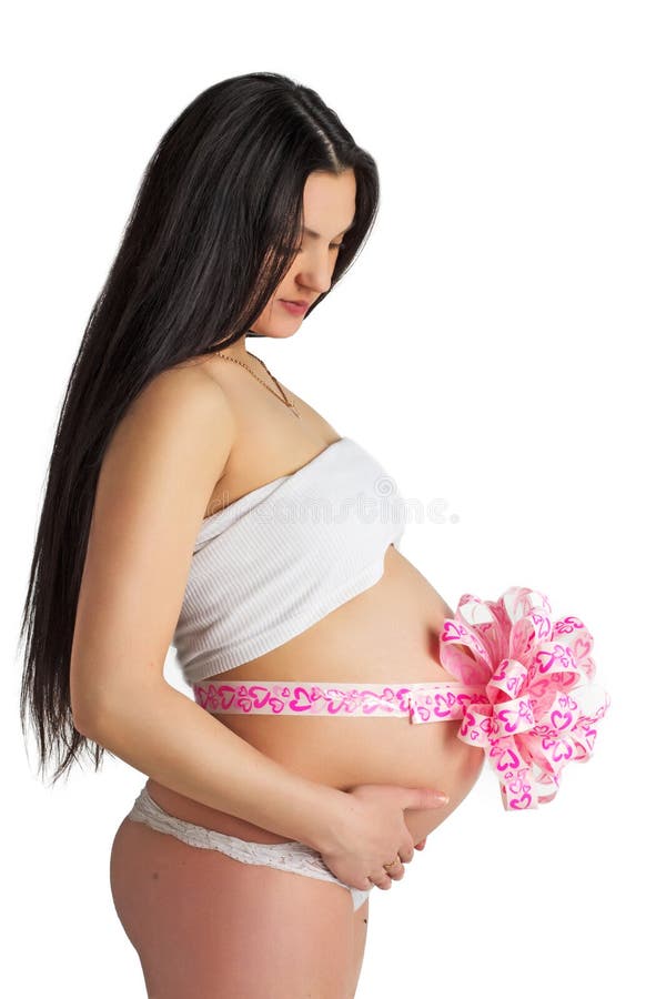 Pregnant girl with pink bow. Isolated on white background royalty free stock image