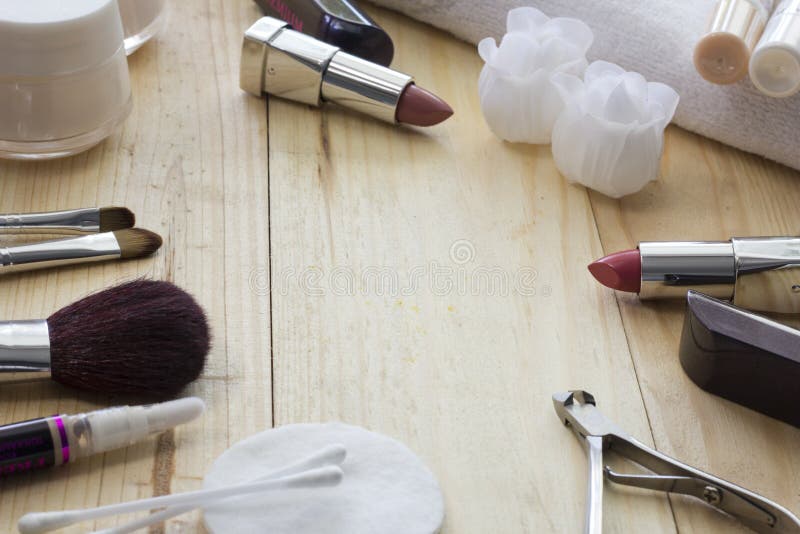 Table with makeup , brushes, lipstick and cream. Soap in the form of roses stock images